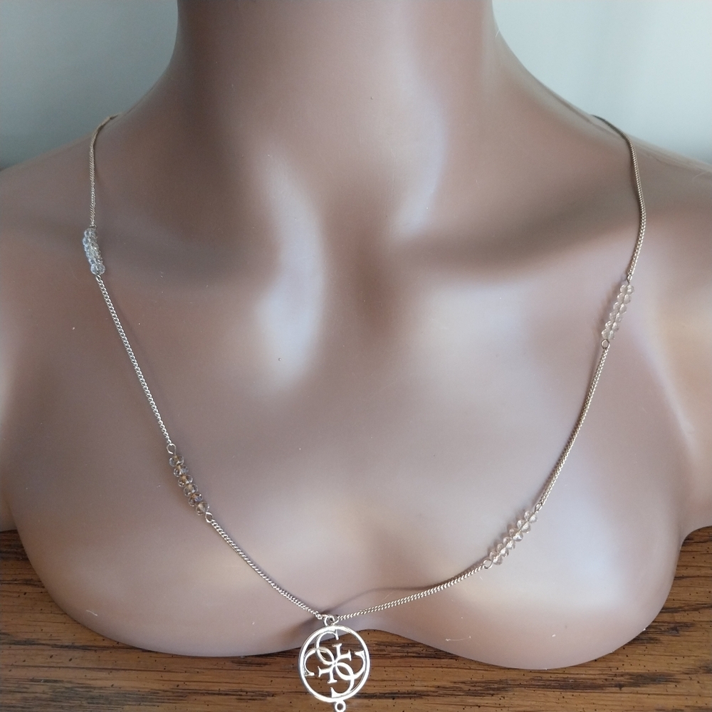 Guess Gold and Crystal Pendant Necklace - Picture 2 of 13